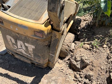 towing a stuck new holland skid steer|drag a skid steer without running.